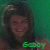 A person with dark hair and a green background appears in two side-by-side frames, the right frame showing color-shifted text below.