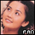 Pixelated close-up of a person's face with light skin tone, dark hair, and visible mouth showing teeth; white text 'FAN' in block letters at bottom right.