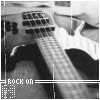 Black-and-white image of a guitar neck with frets and strings, featuring "ROCK ON" text and a pixelated number "15" below it, with subtle animation changes in vertical lines.