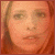 A pixelated close-up of a person's face showing two sequential expressions: eyes open then closed, with reddish-brown hair visible on both sides.