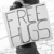 Four- of black-and-white pixelated text and imagery with heart symbols, featuring phrases like "FREE HUGS" and "FOREVER IN YOUR ARMS."