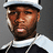 Pixelated portrait of a person wearing a white cap and dark jacket with light trim, set against a gray background.