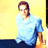 Pixelated static image of a person in light blue shirt against yellow background with dark lower section.