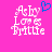 Pixelated text 'Ashley Loves Brittle' in white with a blue heart symbol on pink background, two versions side-by-side.