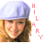 Pixelated image of a person with light brown hair wearing a white cap, next to vertical pink text reading HILARY.