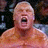 A pixelated close-up of a shirtless man with light skin and short hair, mouth open in an aggressive expression against a dark background.