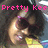 Pixelated image of two people kissing with pink text reading 'Pretty Kee' above them, set against a dark background with light and dark patches.