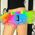 A pixelated image of a person wearing black shorts and a colorful tutu, with text overlays changing across four