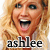 Pixelated close-up of a person with light brown hair and open mouth, below which is the text 'ashlee' in black lowercase letters.