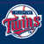 Pixelated circular icon with white border and blue background, featuring red script text "Twins" over a baseball graphic.