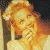 A pixelated image of a person with light brown hair holding their hand near their face, next to green text reading 'Original Icons .com' on a dark background.