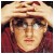 Pixelated static image of a person wearing sunglasses and a light-colored hat with dark red clothing, rendered in low-resolution 256x256 pixels.