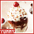 Pixelated static image of a dessert with whipped cream, chocolate sauce, and a cherry on top inside a red-bordered frame with "YUMMY" text at the bottom.