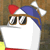 Pixelated character with large brown eyes, white face, blue and red headwear, and a blank rectangular mouth area against a brown background.