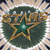 A static pixelated icon features a green star with a white center surrounded by a golden, ornate, five-pointed star shape on a dark green circular background with a light brown border.