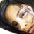 Pixelated close-up of a light-skinned face with closed eyes, dark hair, and visible ear against a dark background.