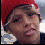 Animated sequence showing two young people in separate with one changing from a person wearing red headwear to another person with blonde hair