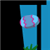 Pixelated static image of a baseball inside a blue cylindrical tube with green grass at the base against a black background.