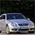Pixelated static image of a light blue sedan with dark blue windows against a dark background, viewed from a low angle.