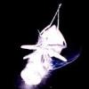 A white, stylized insect-like figure with segmented body parts and antennae against a black background, emitting a faint blue glow.