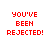 Red pixelated text on white background reads "YOU'VE BEEN REJECTED!" in four identical arranged in a