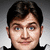 Pixelated portrait of a person with dark hair and blue eyes on left, adjacent to gray background with pixelated text reading 'Bring forth ye booty.'