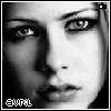 Black-and-white close-up of a person's face with visible eyes, nose, lips, and hair; text 'avril' appears in pixelated font at bottom left.