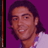 Pixelated static image of a person with dark hair and light skin wearing a white shirt against a solid purple background, displayed as a 48x48 buddy icon.