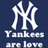 A static image with a blue square containing white 'NY' logo and text, next to pink pixelated text on black background.