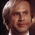 Pixelated image of a person with light brown hair and formal attire on the left, next to green text reading 'Original Icons .com' on a dark background.