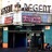 Pixelated image of a building facade with 'REGENT' text above a marquee, flanked by vertical columns and a dark entrance.