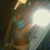 A blurry animated icon shows a figure in a blue top and brown pants with a bright light source on the right side, transitioning between two states.