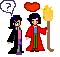 Pixel art animation of two figures: one in black robe with pink shirt, the other in red robe holding torch. Various symbols appear above them including question marks, hearts, and explosions.