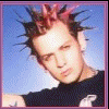 nine static images showing a person with pink-tipped spiky hair in various poses, clothing, and backgrounds including blue sky, black beanie, and dark hoodie