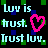Pixelated text reads 'Luv is trust. Trust luv.' with a pink heart symbol on black background, surrounded by green and blue squares.
