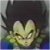 Pixelated static image of a character with spiky black hair, closed eyes, and a wide grin, wearing a green and blue outfit against a dark background.