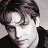 A pixelated buddy icon featuring a person's face on the left and stylized text reading "Will Friedle" on the right against a gray background.