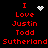 Red pixelated text on black background with animated white pixel symbols above 'I Love Justin Todd Sutherland' text blocks.