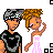 Pixelated cartoon couple with gray headband and pink dress, text changes across frames from 'all i want for christmas is you' to static display.