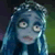Pixelated static image of a blue-skinned character with wide eyes, long dark hair, and visible tears against a dark green background.