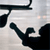 Static 50x50 pixel icon showing a black silhouette of a boxer in mid-punch against a light gray background with subtle horizontal lines.