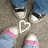 A pixelated image shows feet in sneakers with a heart symbol on the ground, accompanied by green text reading "love is for those who need more drama in" and "life <3".