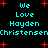 Pixelated cyan text on black background with red plus signs, repeating 'We Love Hayden Christensen' in two