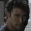 Four pixelated frames of a person with dark hair in grayscale tones showing sequential facial expressions and head position changes.