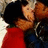 Pixelated image of two people kissing on a red background with yellow text reading 'damning', 'we're everything', and 'gasp' in different sections.
