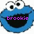 Blue cartoon character with large white eyes and black pupils, open mouth showing black interior, purple text 'brookie' over mouth in first frame, purple pixelated pattern in second frame.