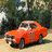 Animated sequence showing an orange car in four distinct scenes: a road with trees, two Confederate flags, a hand holding the car, and floating above clouds.