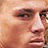 Static 48x48 pixel icon showing a close-up of a person's face with visible eyes, nose, and mouth on a light background.