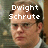Pixelated image of a man with short brown hair and glasses, wearing a white shirt under a dark jacket, with overlaid text identifying him as 'Dwight Schrute' on the left side.