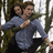 Animated sequence of two people in a forested background with overlaid text changing across frames.